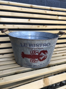 A very decorative, beautiful zinc bowl small with the text 